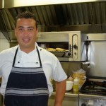 Kleber Santana cooks at Piha Surf Club restaurant