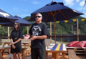 Peter Brown, club president, open the bar. Stephanie, Corona marketing manager to left.